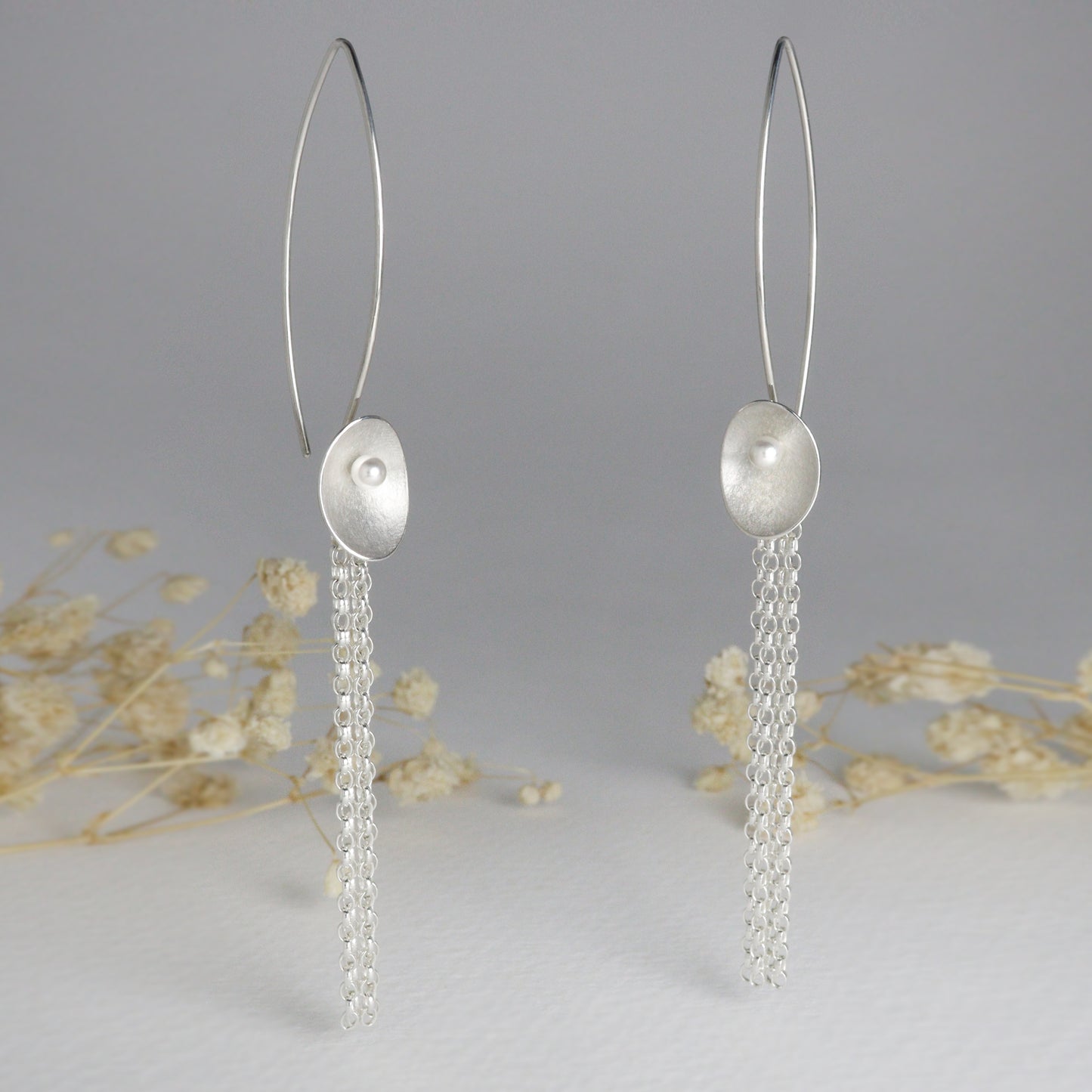 Long silver and pearl large seed earrings