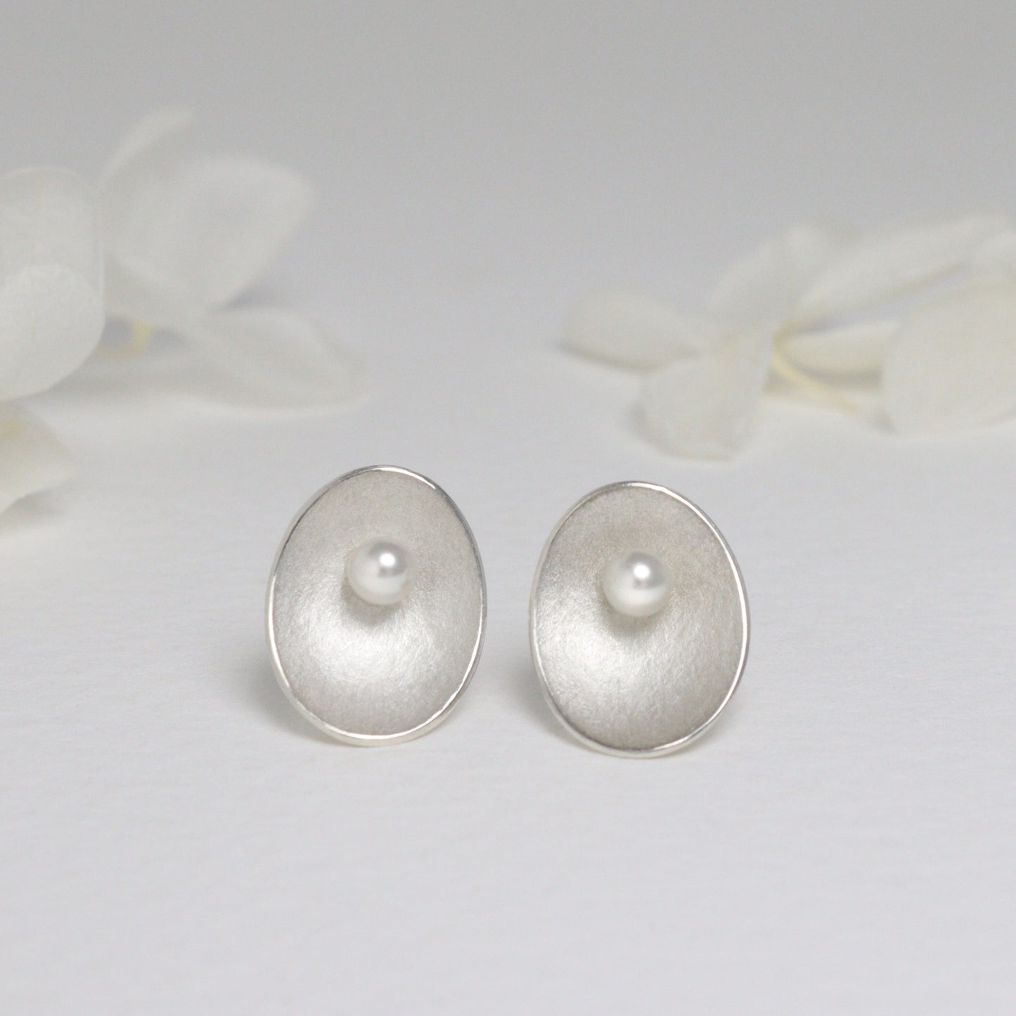 Large silver and pearl seed stud earrings