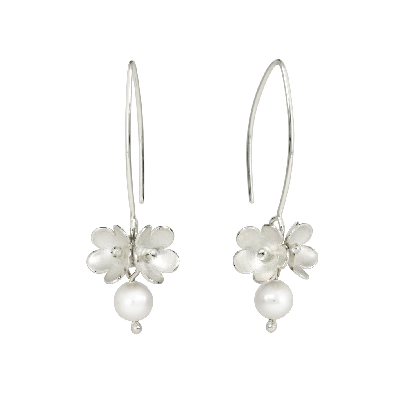 A pair of silver drop earrings featuring a small blossom flower cluster with a dangling round pearl, shown against a plain white background.