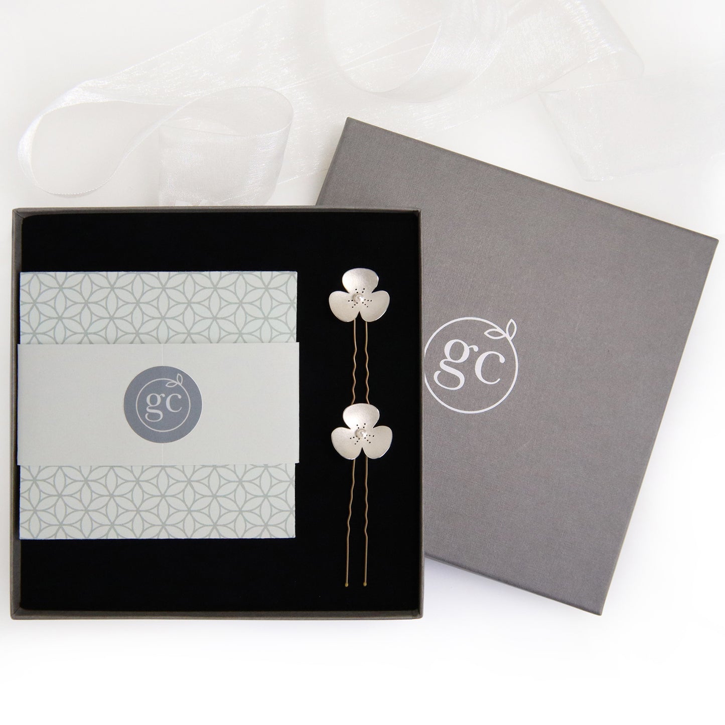Two Silver and Pearl Poppy hairpins, which instantly convert into earrings