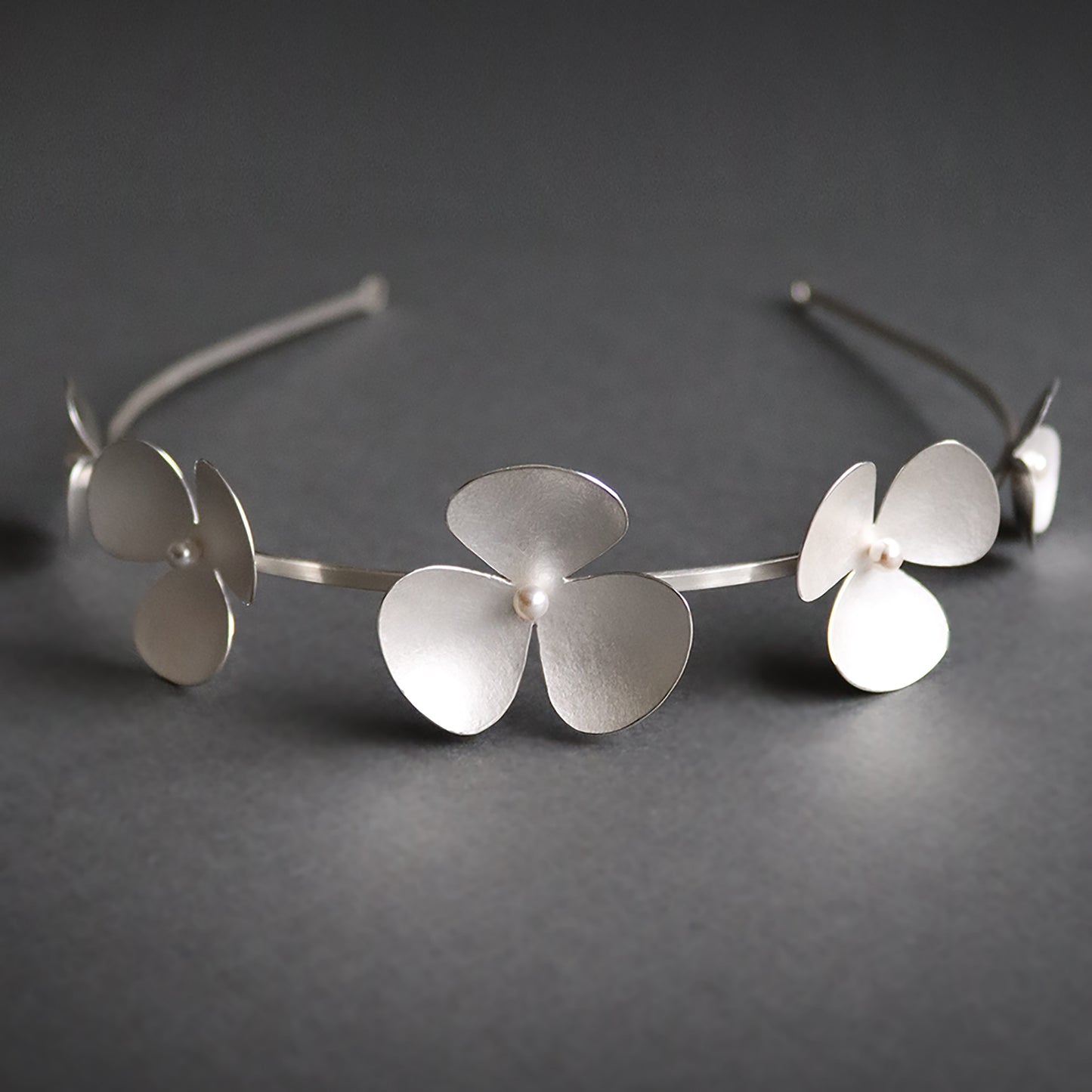 Silver Poppy headband, which becomes a set of jewellery