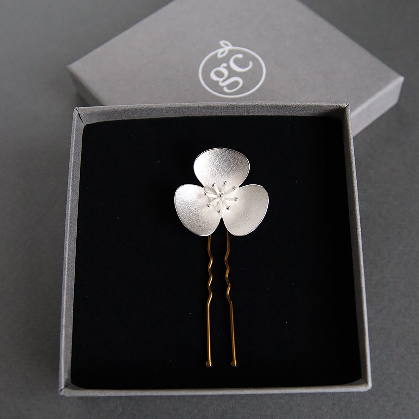 Single Silver Poppy hairpin, which instantly converts in to a pendant