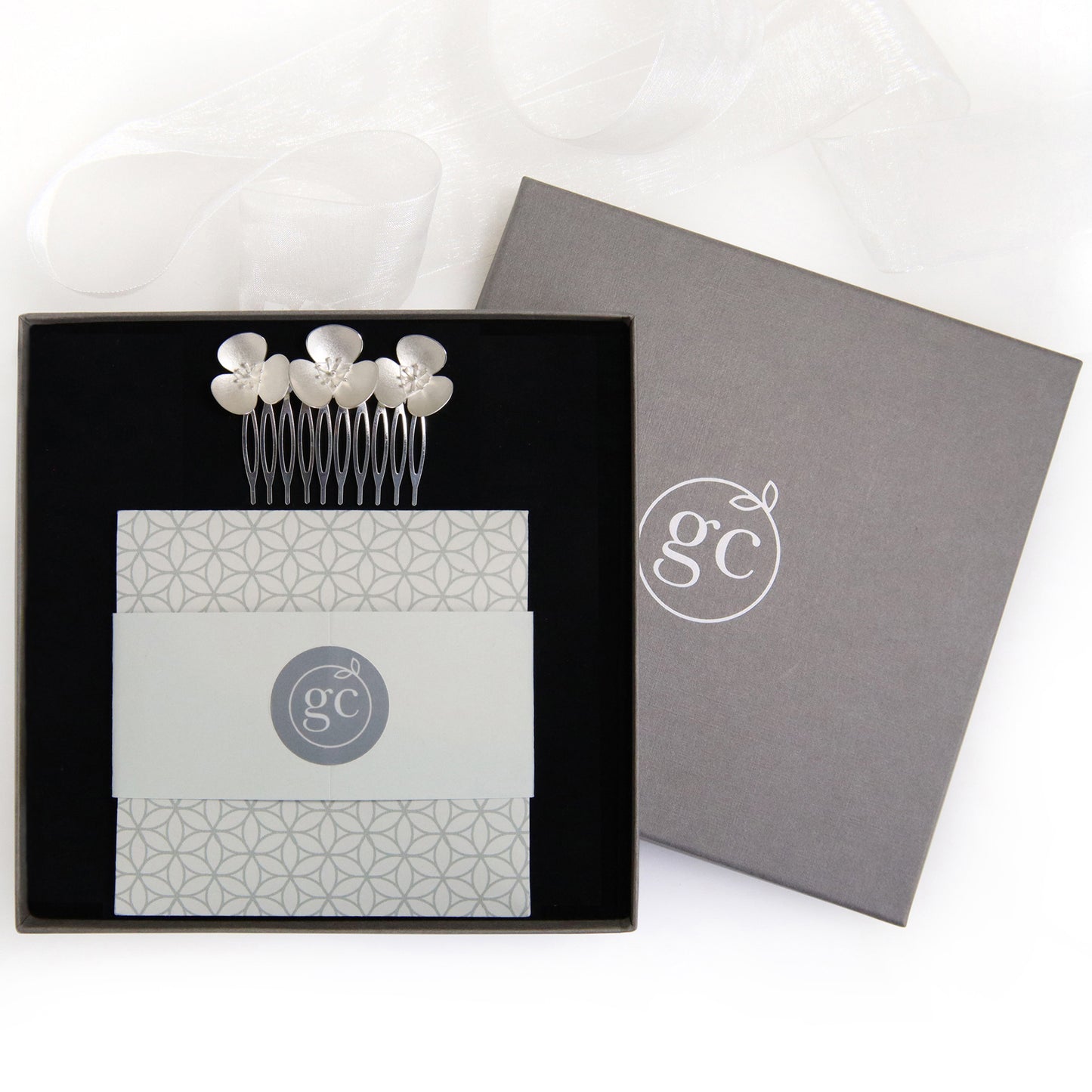 Silver Poppy instant convert hair comb, which becomes a jewellery set