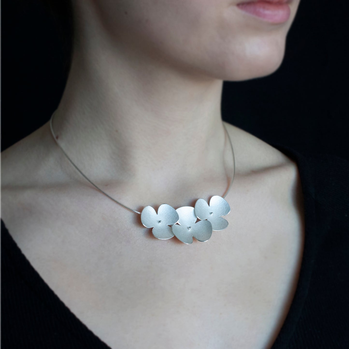 Silver Poppy headband, which becomes a set of jewellery