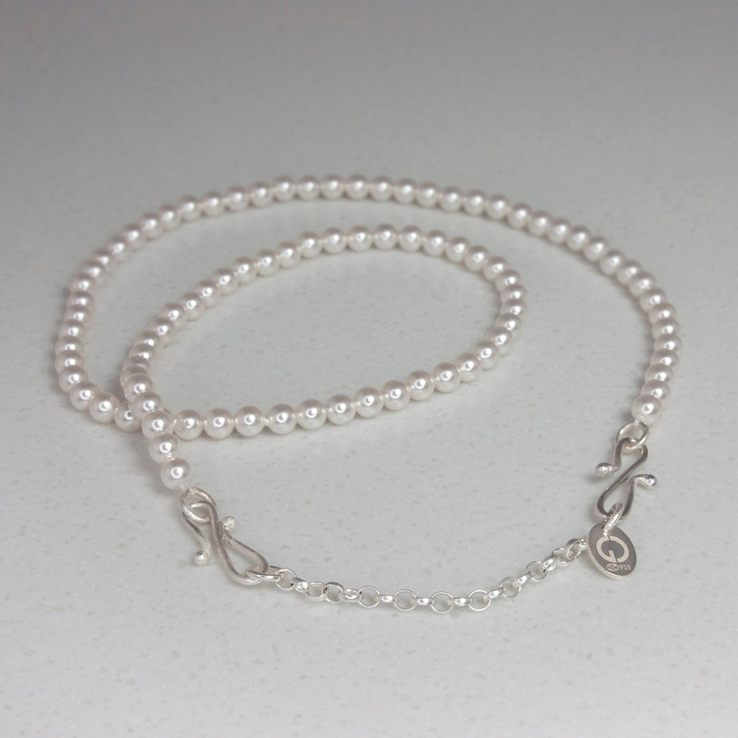 Silver Orchid flowers on pearl soft headband, becomes a pendant