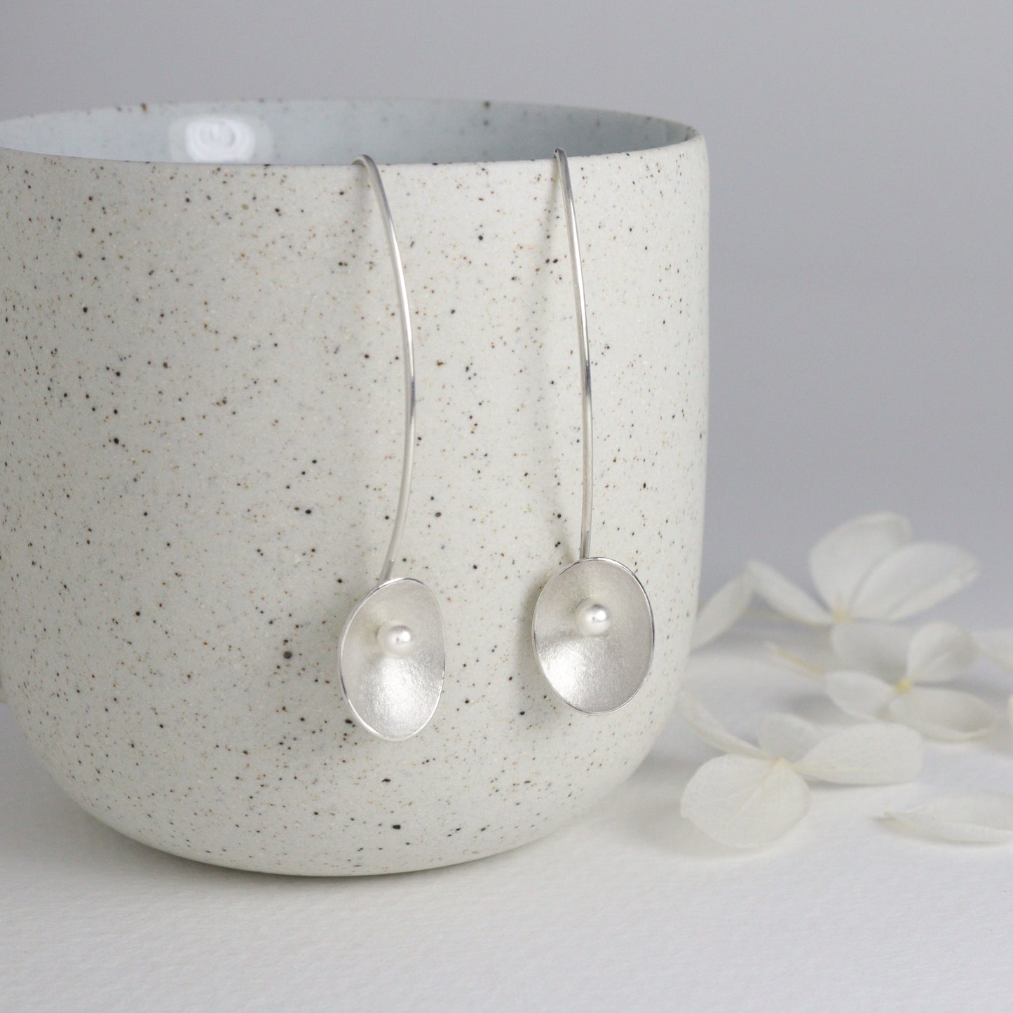 Long silver and pearl large seed earrings