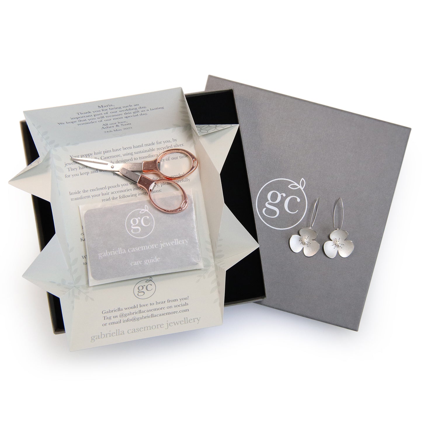 Two Silver and Pearl Poppy hairpins, which instantly convert into earrings