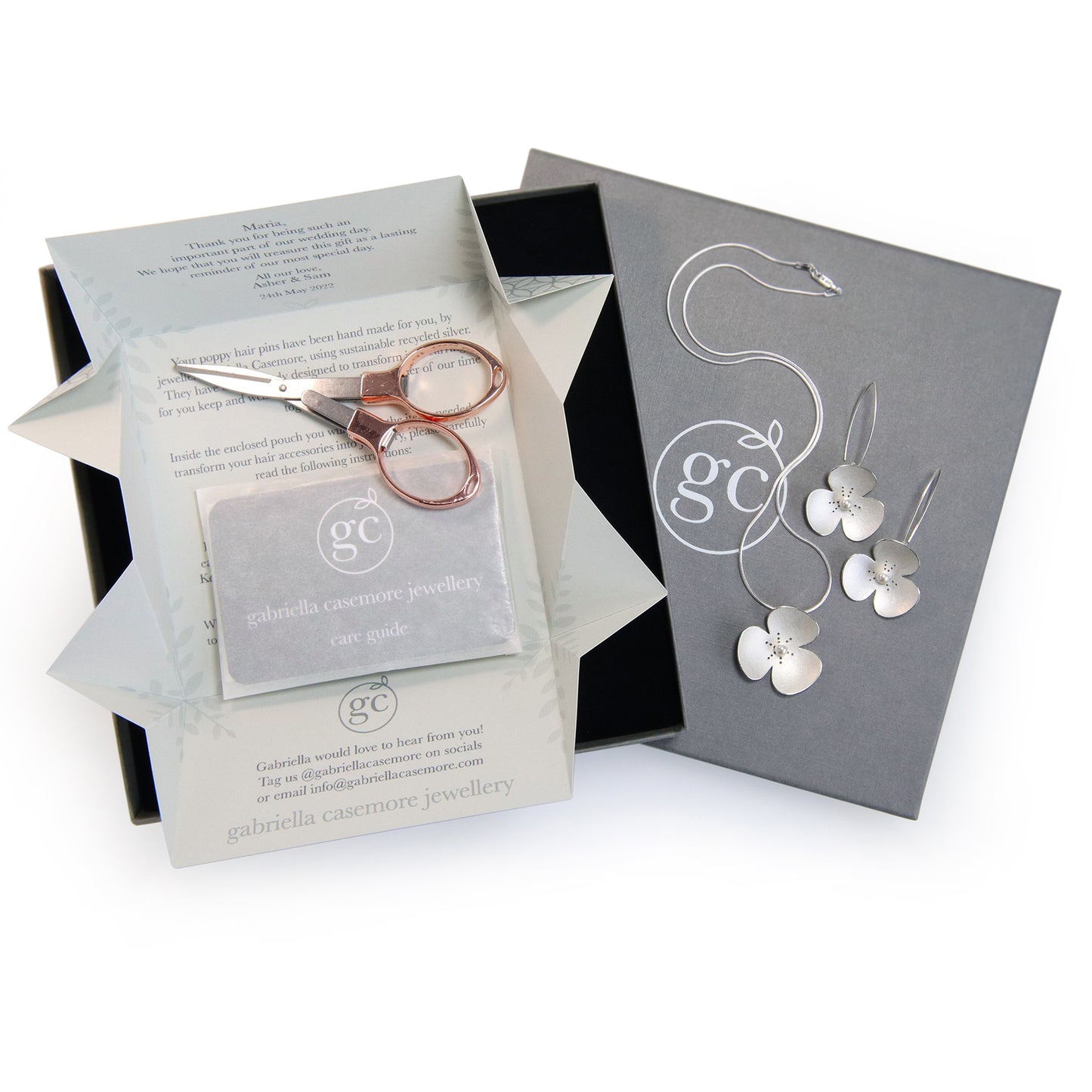 Three Silver and Pearl Poppy hairpins, which instantly convert to a set of jewellery