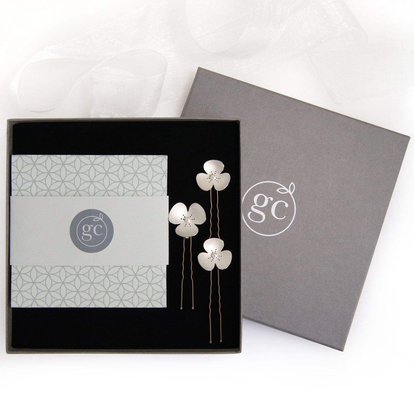 Three Silver and Pearl Poppy hairpins, which instantly convert to a set of jewellery