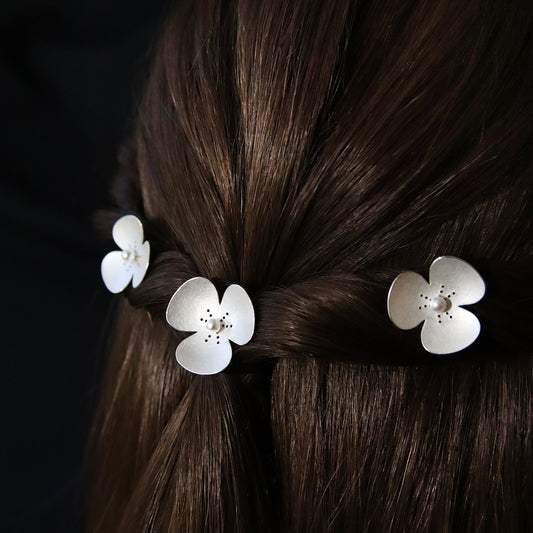 Three Silver and Pearl Poppy hairpins, which instantly convert to a set of jewellery