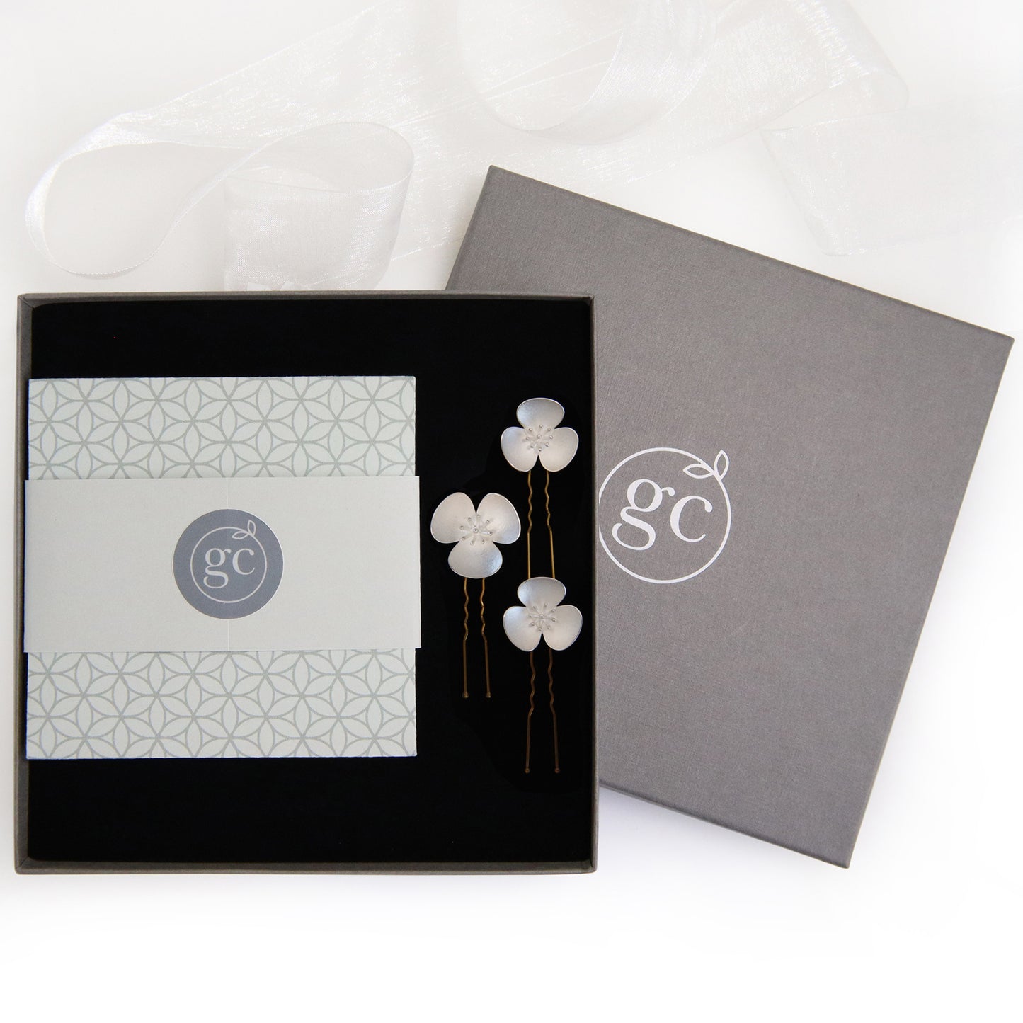 Three Silver Poppy hairpins, which instantly convert to a set of jewellery