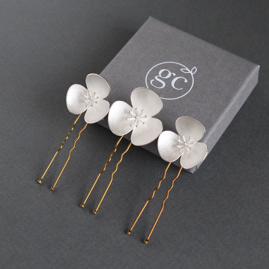 Three Silver Poppy hairpins, which instantly convert to a set of jewellery