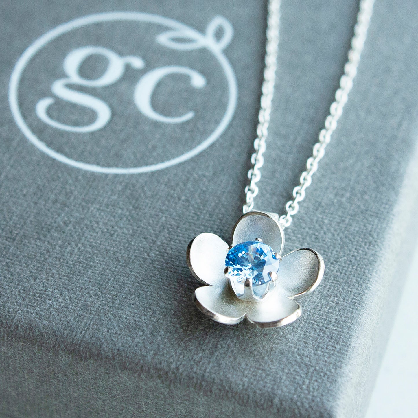 Silver blossom flower necklace with choice of birthstone