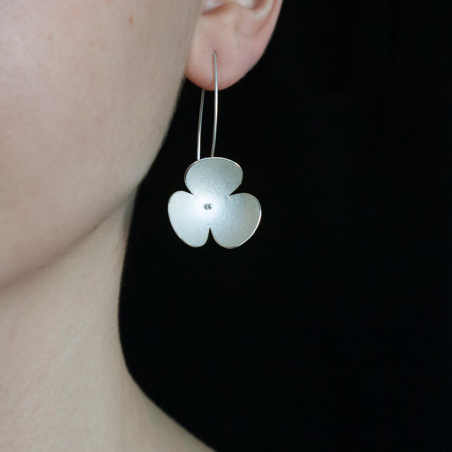 Silver Poppy headband, which becomes a set of jewellery